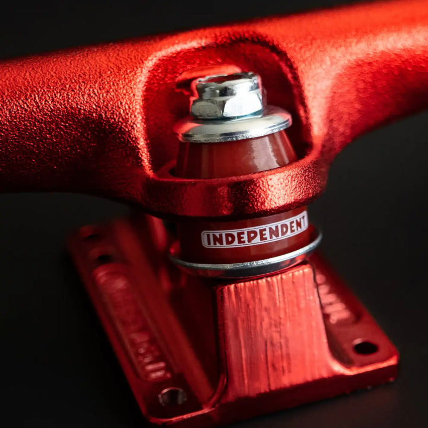 Red skateboard truck with 'Independent' branding on a black background