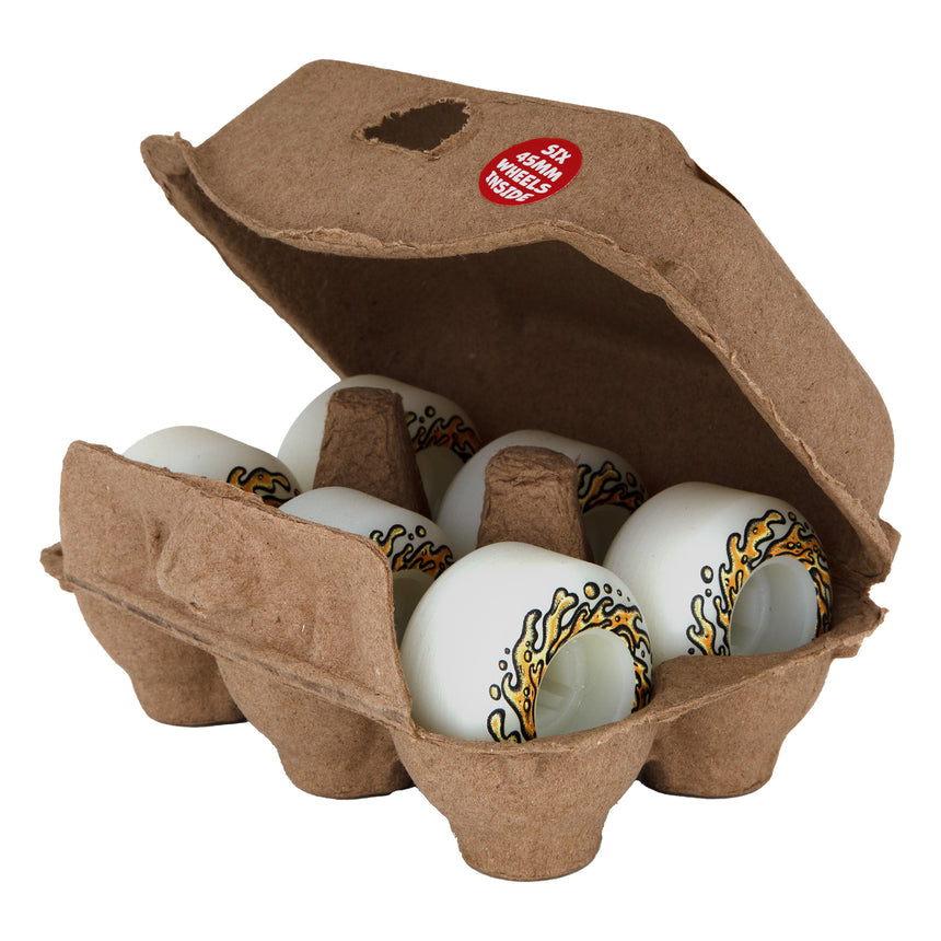 Carton of eggs with decorative patterns on a white background