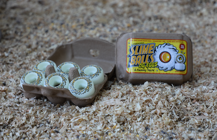 Slime Ball O' Eggs packaging with egg carton on a textured surface
