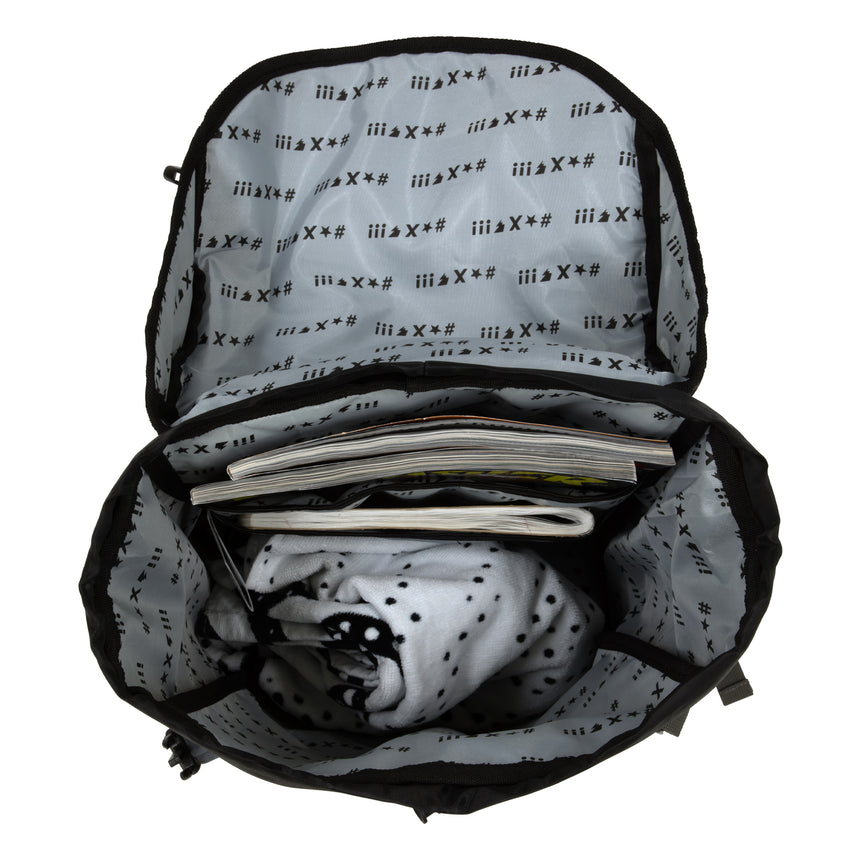 Backpack with black and white patterned interior and items inside on a white background