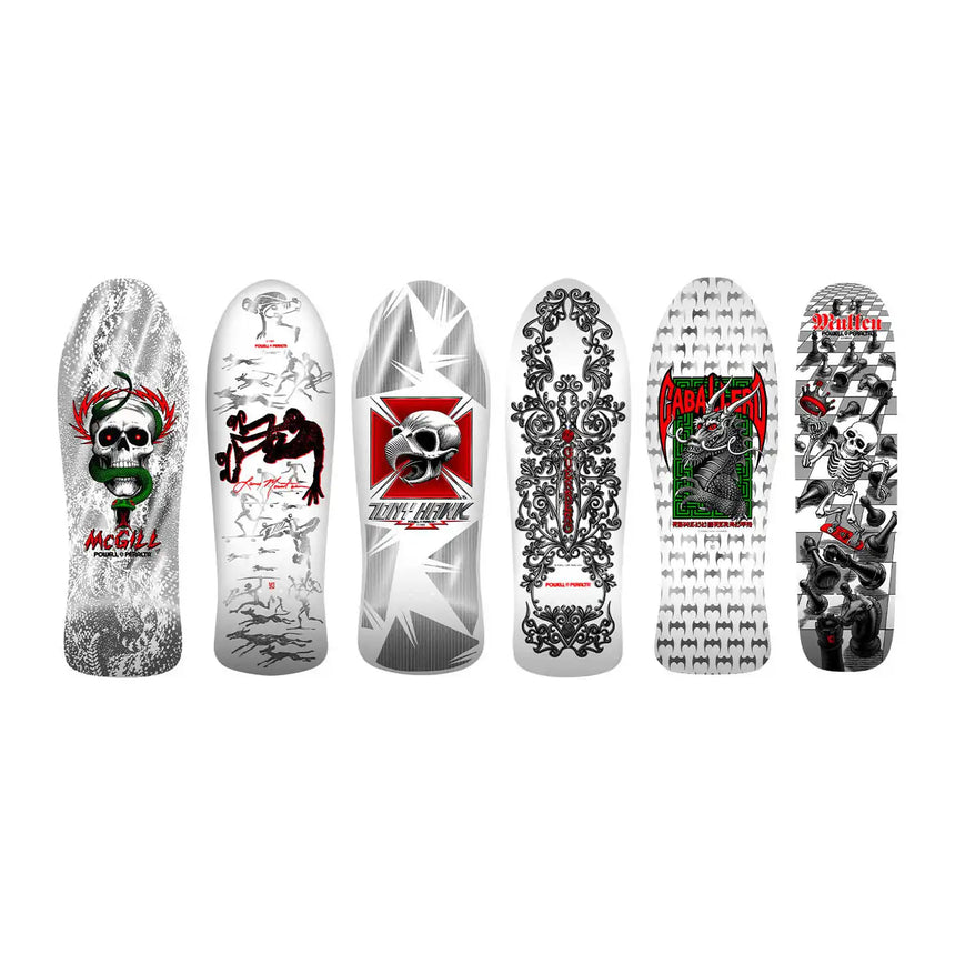 Collection of skateboard decks with various designs on a white background