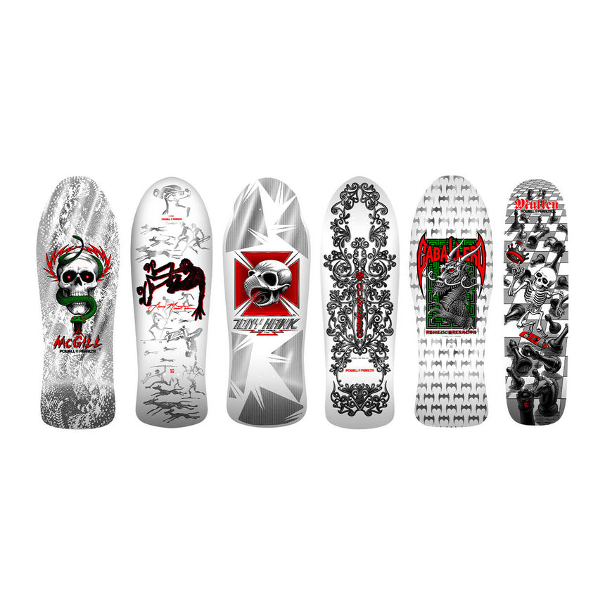 Collection of skateboard decks with various designs on a white background