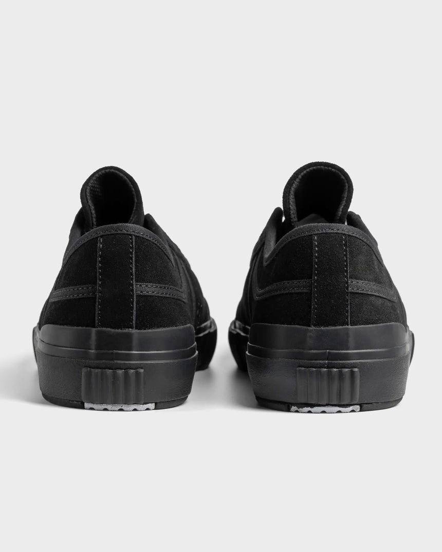 Black sneakers shown from the back on a light gray background
