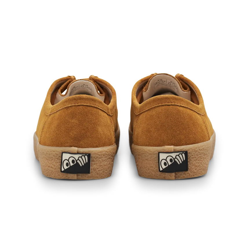 Pair of brown sneakers with a logo on the sole against a white background