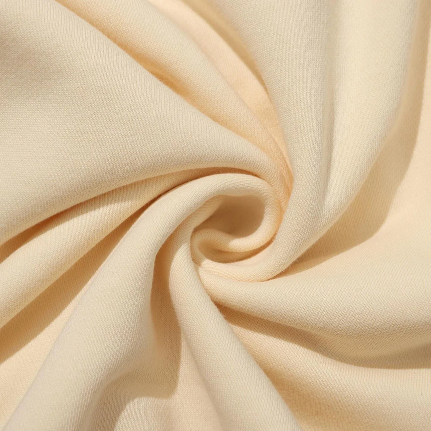 Close-up of beige fabric with folds