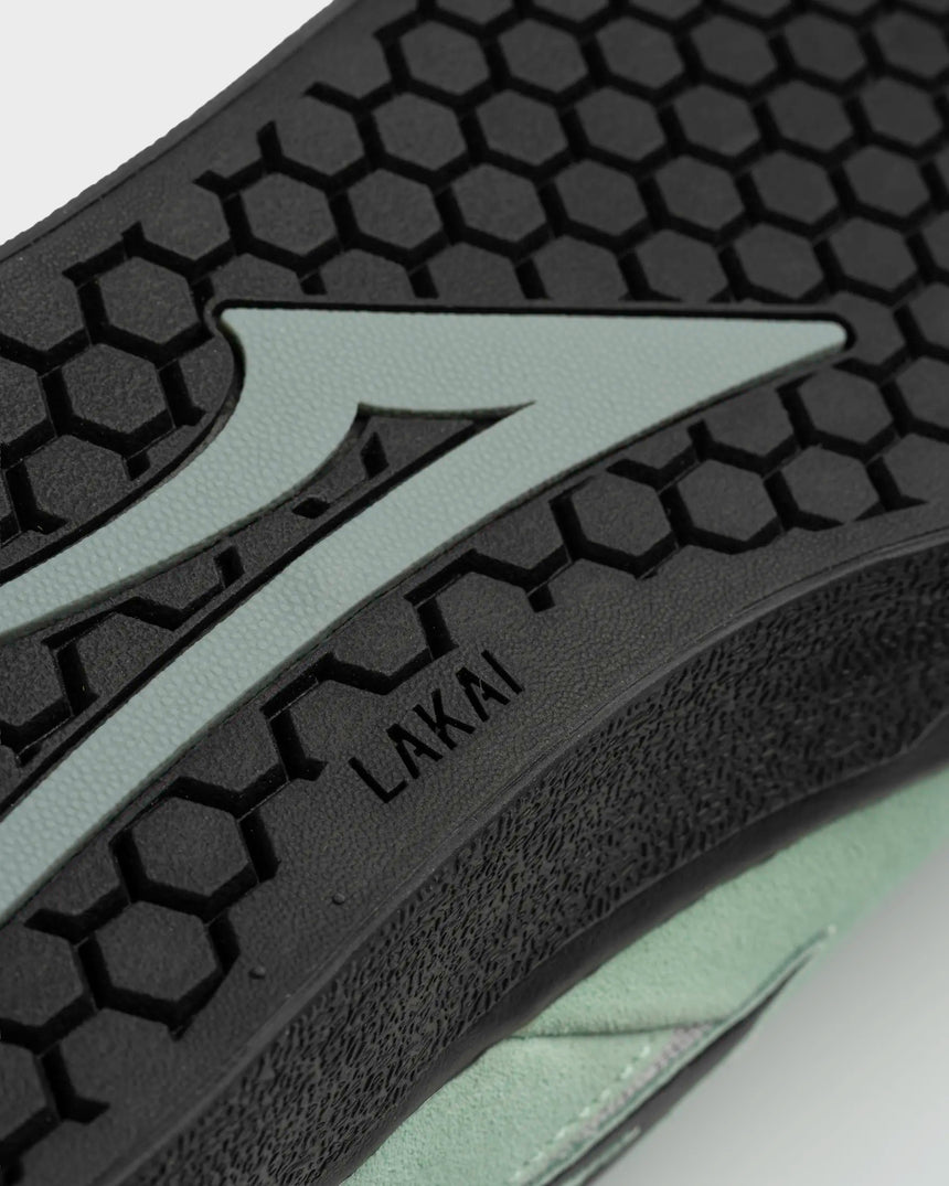 Close-up of a shoe sole with a brand logo on a white background