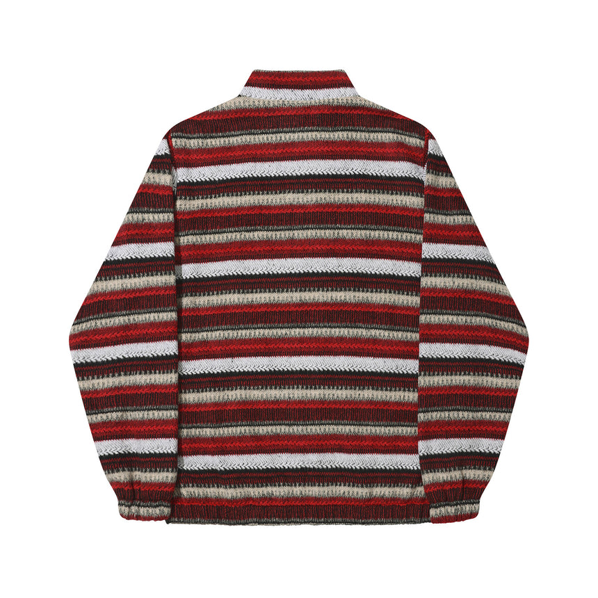 Striped sweater with red, brown, and white pattern on a white background