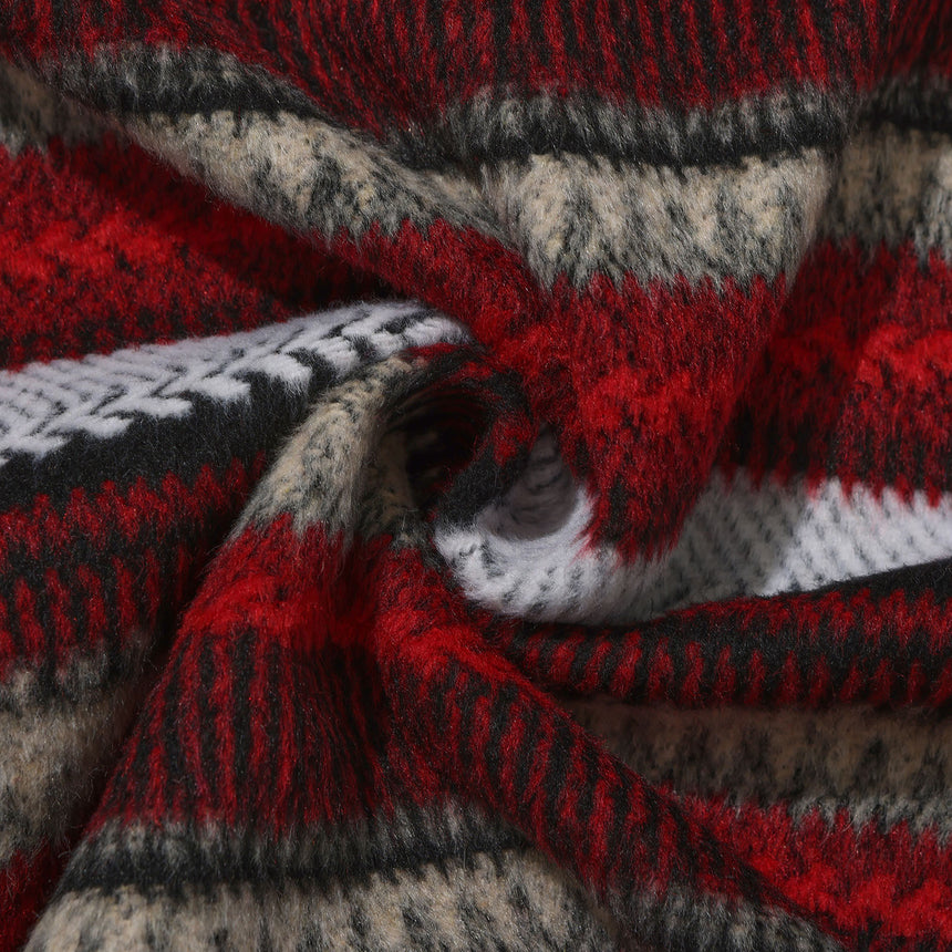Close-up of a knitted fabric with red, gray, and black pattern