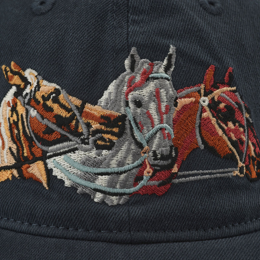 Embroidered design of horses on a dark background