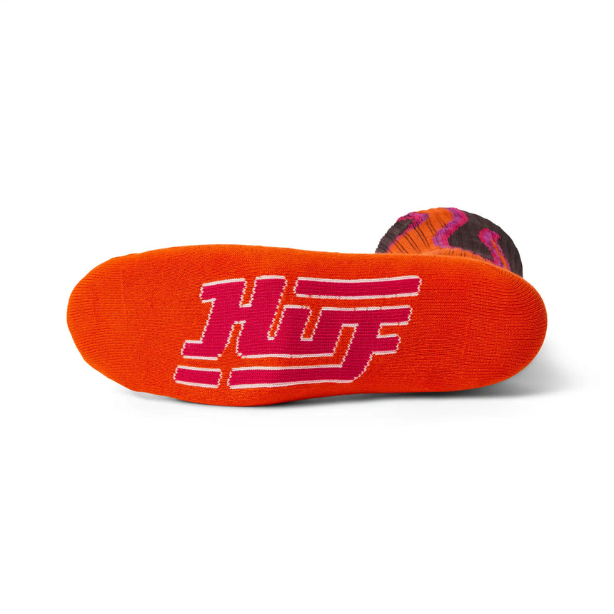 Orange insole with pink 'Huf' logo on a white background