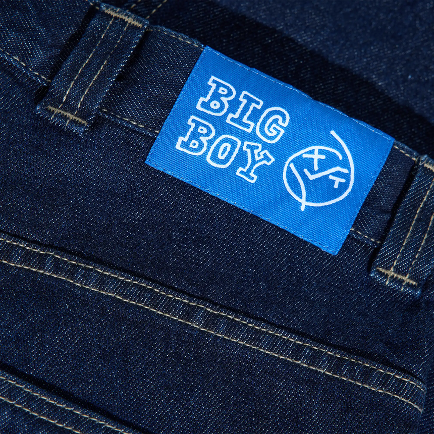 Blue 'BIG BOY' label on a dark denim fabric