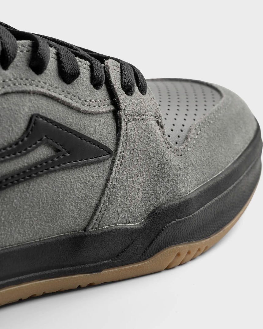 Gray sneaker with black accents on a light gray background