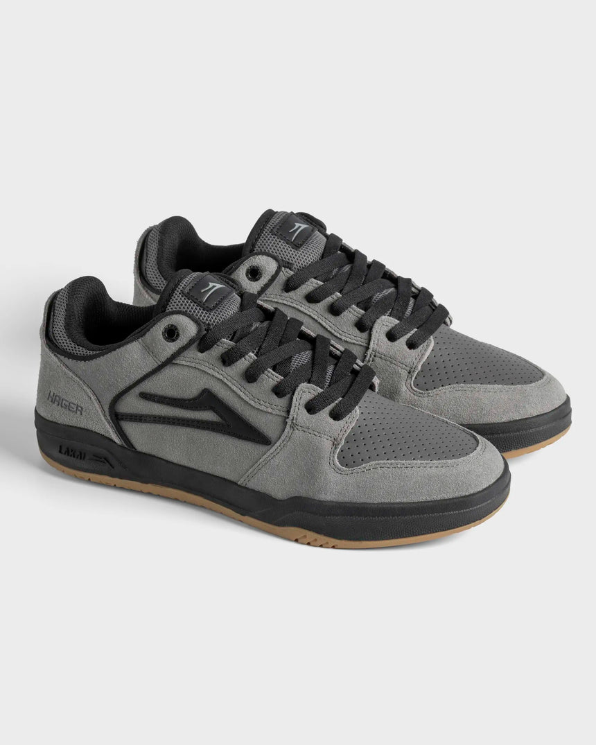 Gray and black sneakers on a light gray background