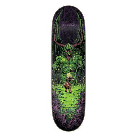 Skateboard deck with a green creature design on a white background