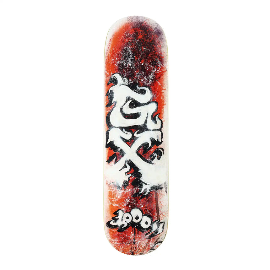 Skateboard deck with red and black design on a white background