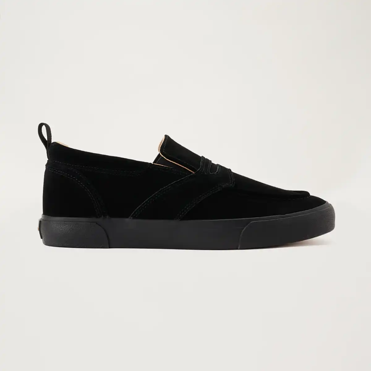 Black slip-on sneaker on a light gray background