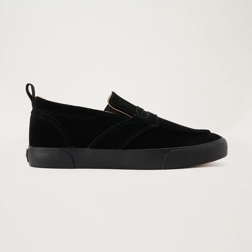Black slip-on sneaker on a light gray background