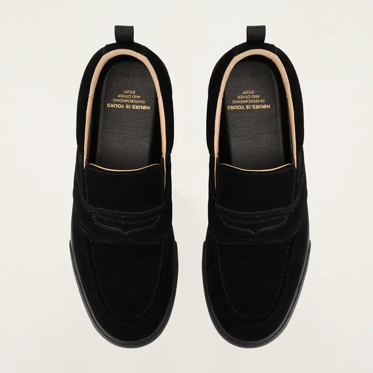 Pair of black loafers on a light gray background