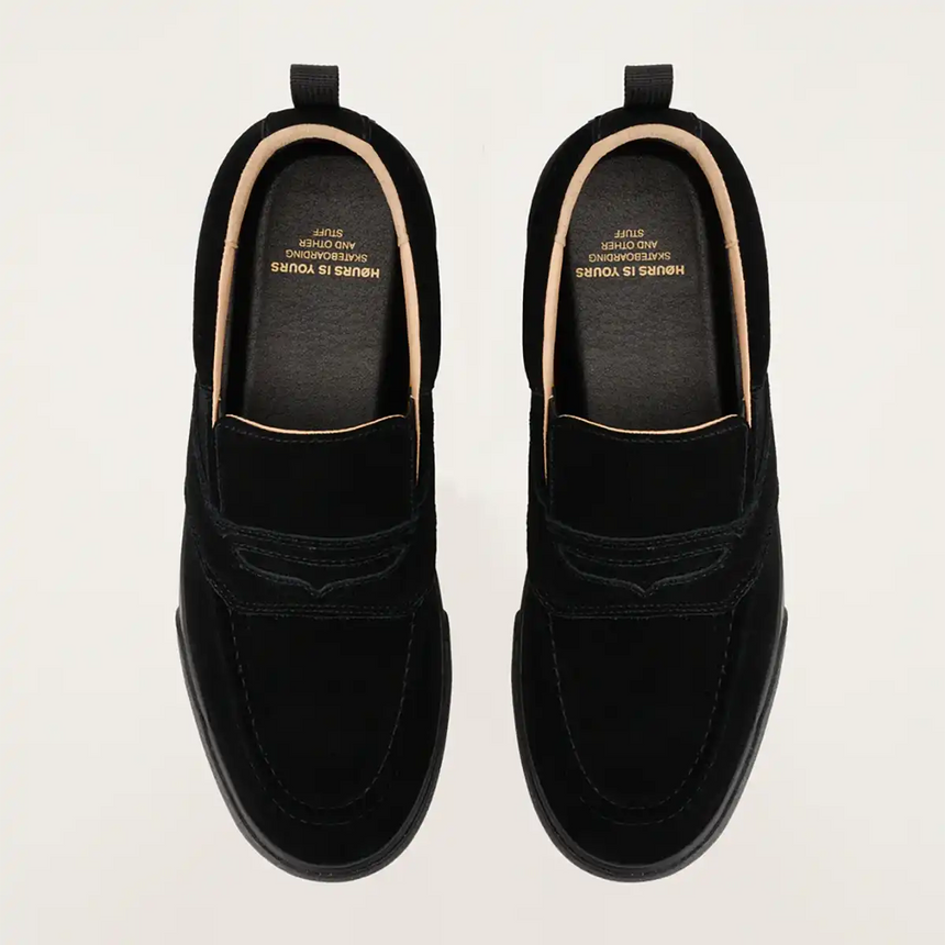 Pair of black loafers on a light gray background