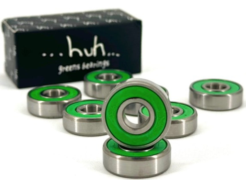 Green and silver bearings with a black box labeled 'huh' on a white background