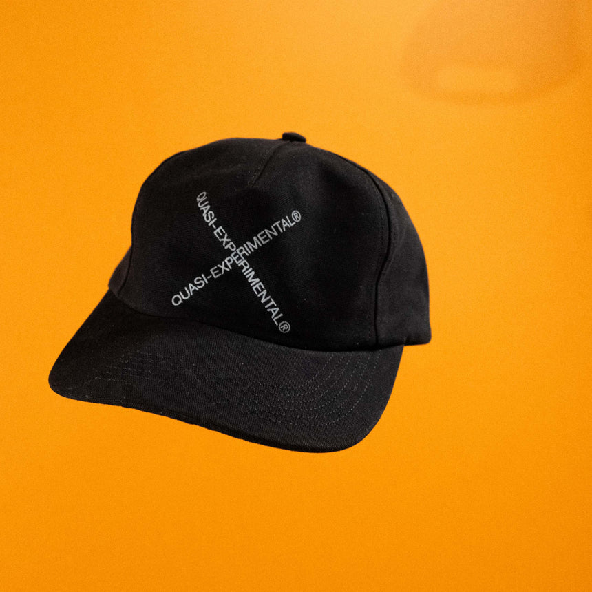 Black cap with text on an orange background