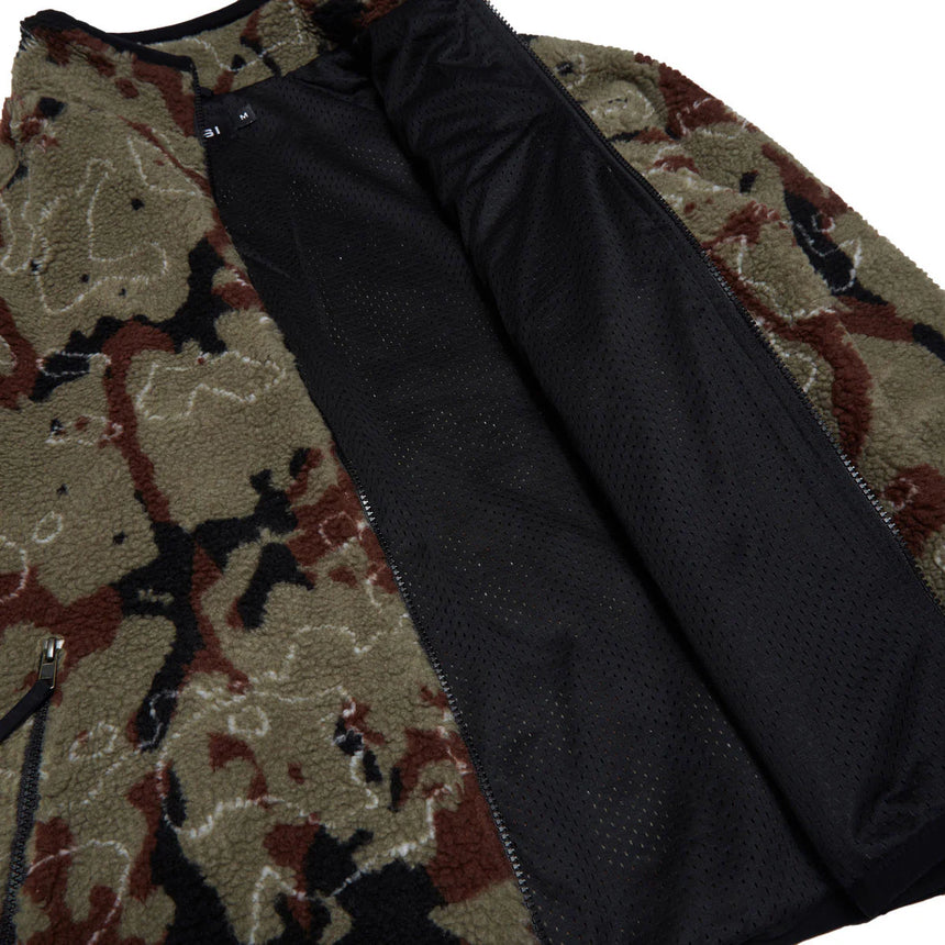 Close-up of a black garment with floral-patterned lining on a white background