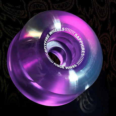 Purple and blue wheel with 'Spitfire Wheels' branding on a dark background