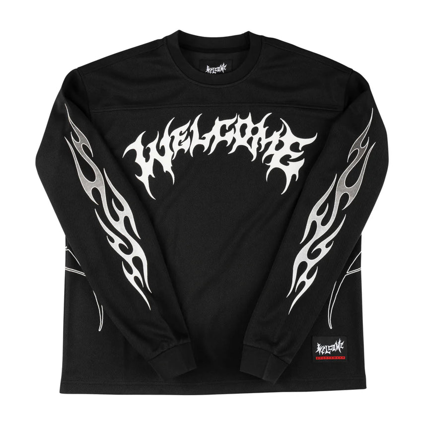 Black long-sleeve shirt with white tribal designs and brand logo on a white background