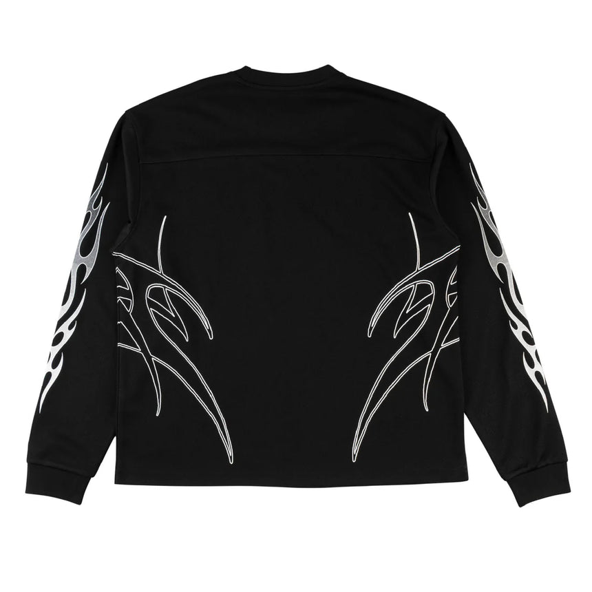 Black long-sleeve shirt with white tribal designs on a white background