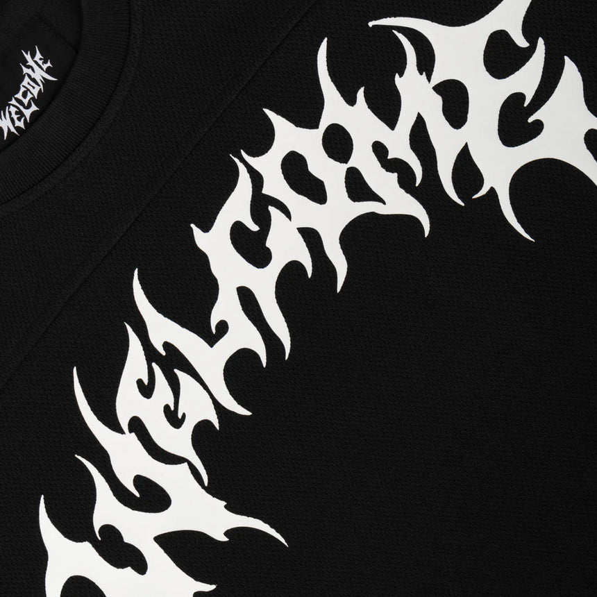 Black t-shirt with white tribal design and brand logo on a black background