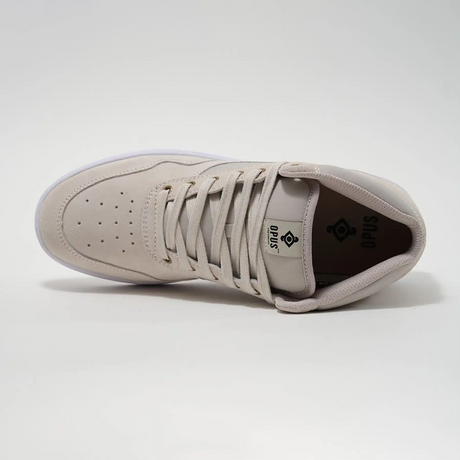 Beige sneaker with brand logo on a light gray background