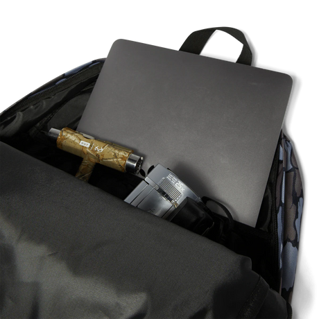 Backpack with laptop, umbrella, and other items on a white background