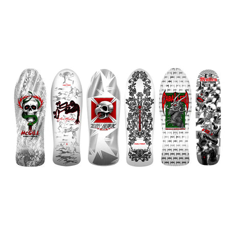Collection of skateboard decks with various designs on a white background