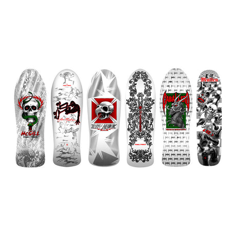 Collection of skateboard decks with various designs on a white background