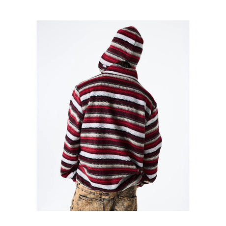 Person wearing a red and white striped hoodie on a white background