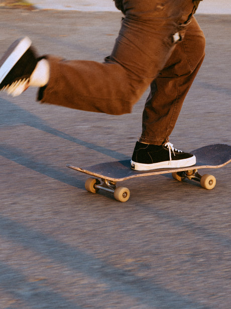Person skateboarding on a concrete surface