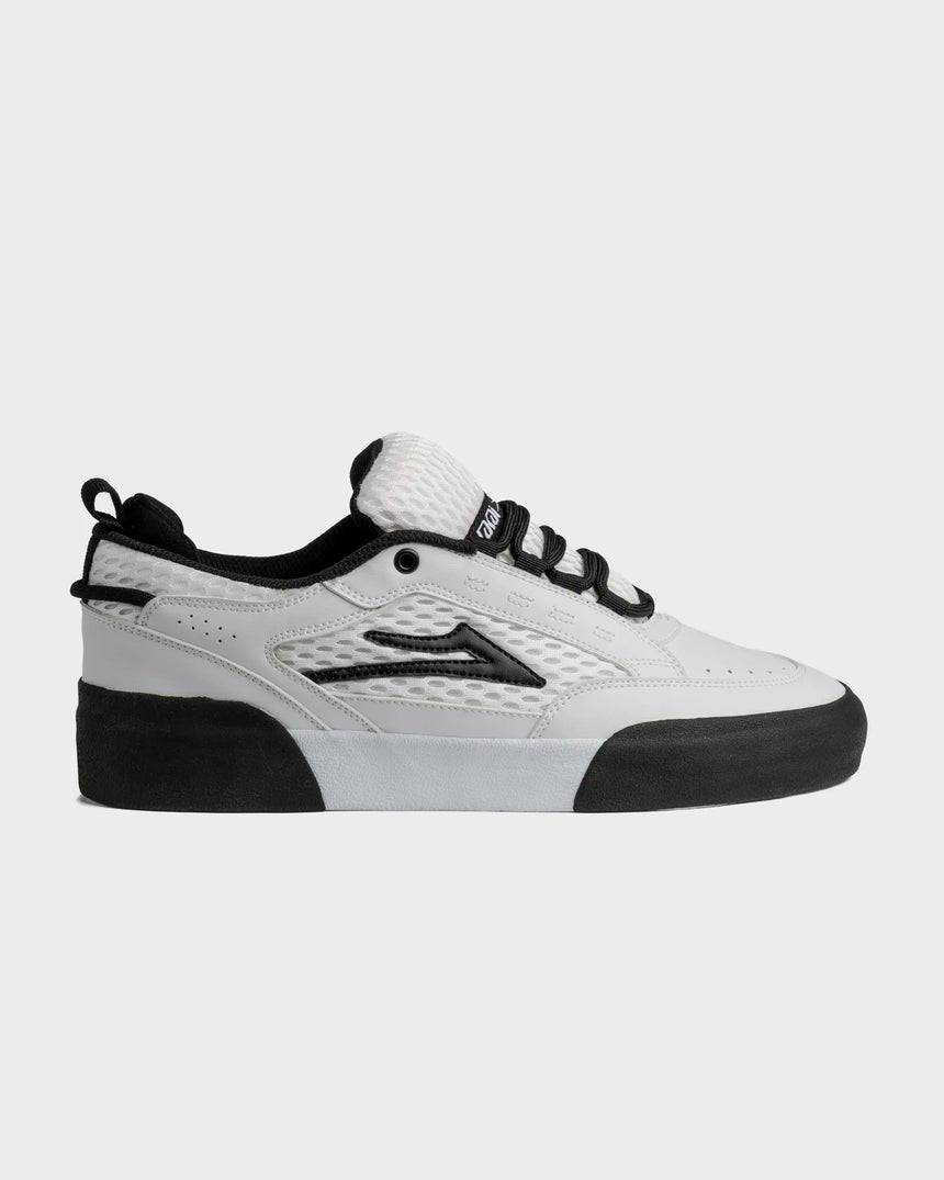 White and black sneaker on a light gray background
