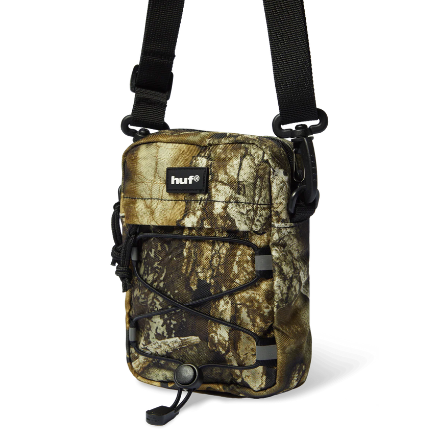 Camouflage crossbody bag with 'huf' logo on a white background
