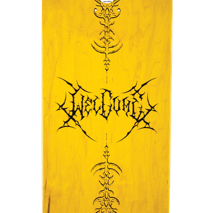 Yellow skateboard deck with black tribal design and text on a white background