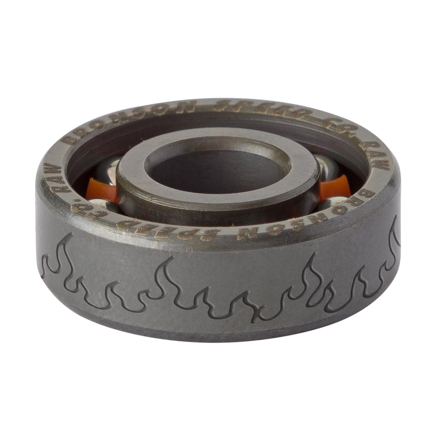 Metal bearing with flame design on a white background