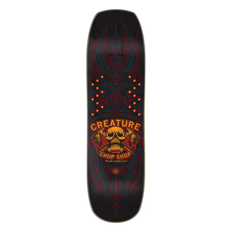Skateboard deck with creature logo on a white background