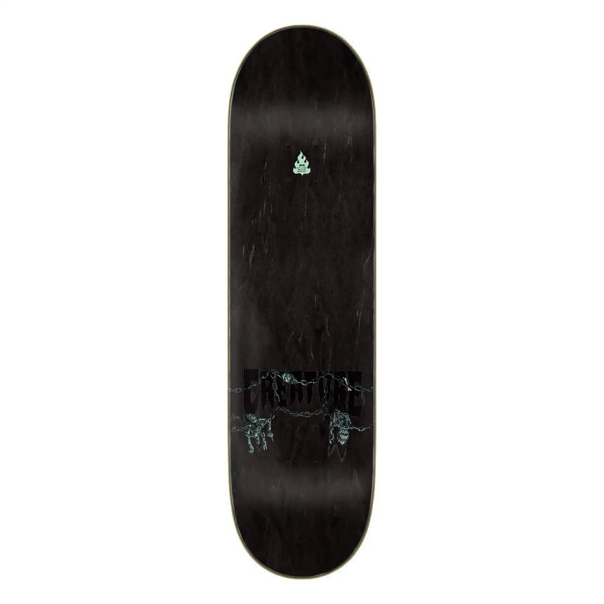 Black skateboard deck with a logo on a white background