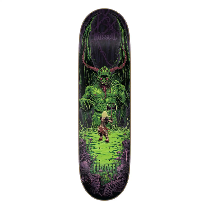 Skateboard deck with a green creature design on a white background