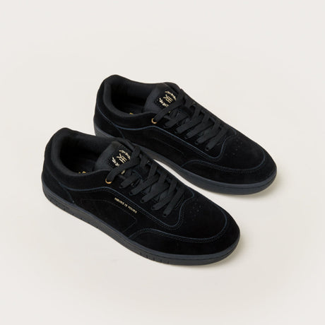 Pair of black sneakers on a white background