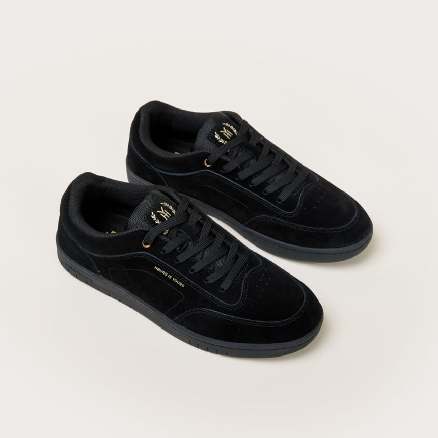 Pair of black sneakers on a white background