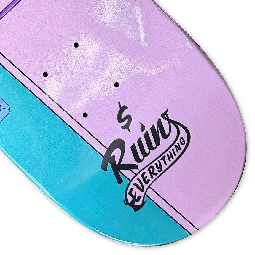 Skateboard deck with 'Ruins Everything' logo on a purple and blue gradient background
