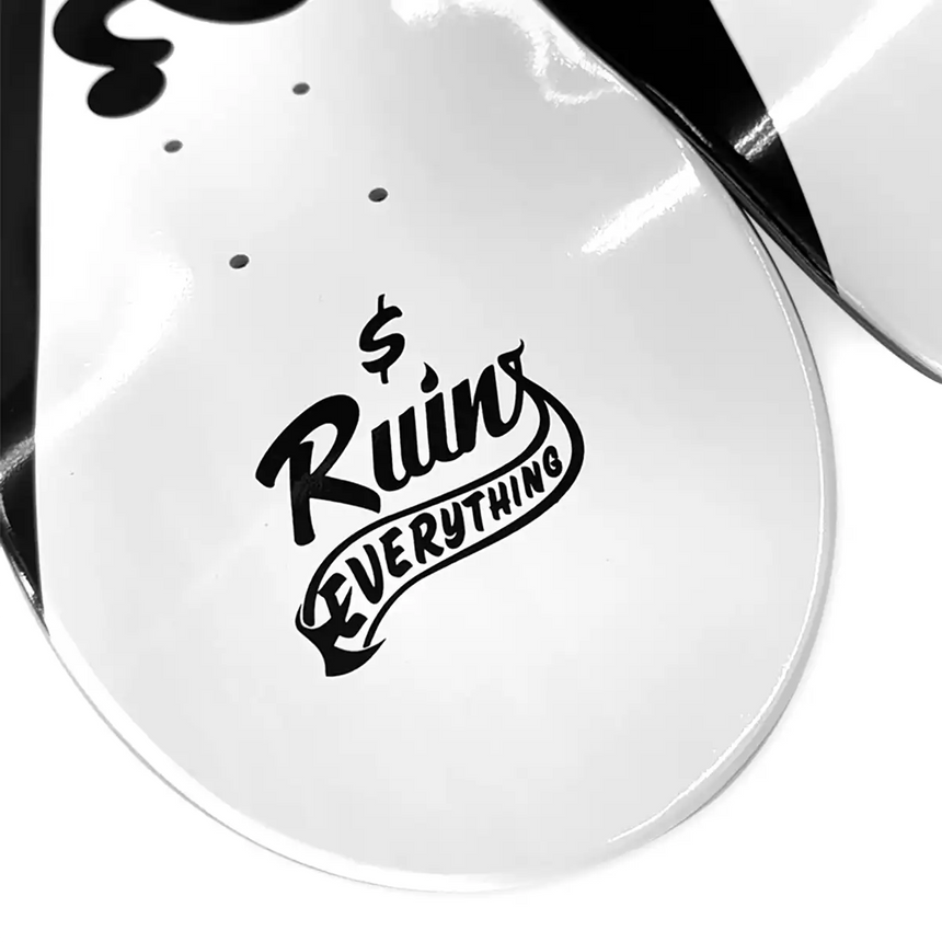 White guitar pick guard with black text 'Ruins Everything' on a white background