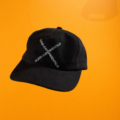 Black cap with text on an orange background