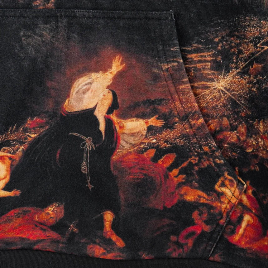 Close-up of a dark, detailed painting with figures and a central figure in a black robe.